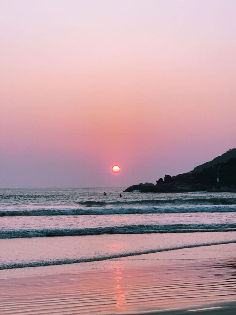 Pink sunset over the beach and water