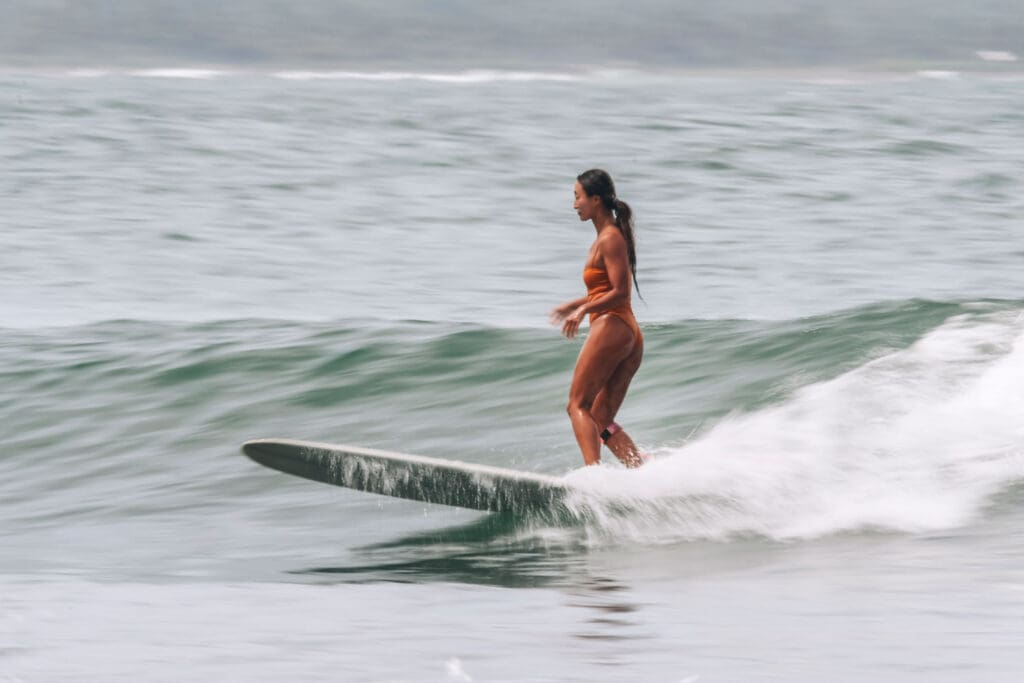 Girl surfing on a wave