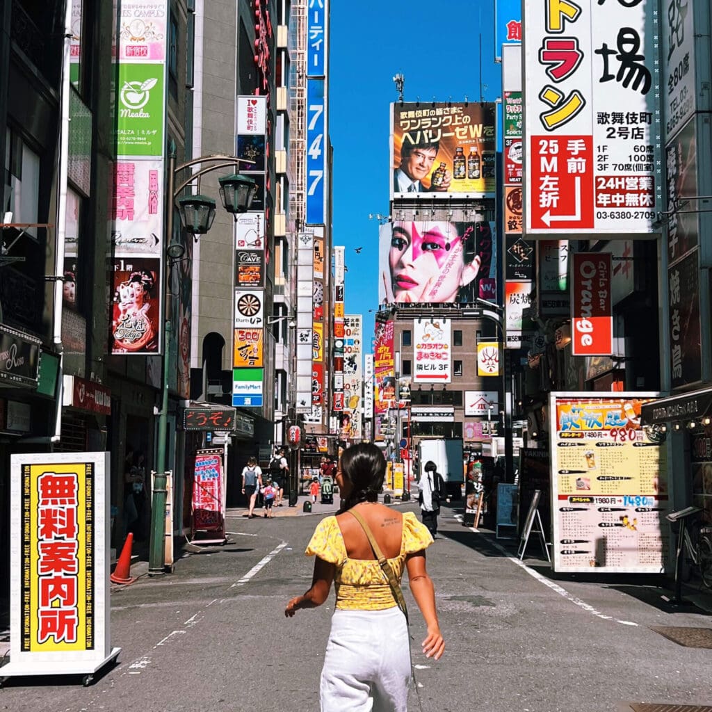 Girl walking on the streets of Kabukicho during the day